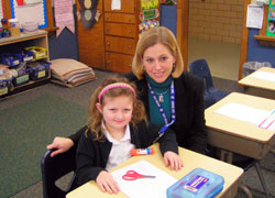 A first-grade teacher at St. Anthony of Padua School in Clarksville, Jacquelyn Singleton describes teaching in a Catholic school as a calling from God. Here, she works with first-grade student Piper Prince. (Submitted photo)