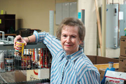 Sheila Gilbert recently became the first woman elected president of the national council of the U.S. Society of St. Vincent de Paul. Here, she poses for a photo at the society’s Client Choice Food Pantry in Indianapolis, where she greets hundreds of people in need every Tuesday morning. (Photo by John Shaughnessy)