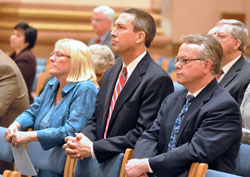 Sue and George Kempf, from left, members of St. Pius X Parish in Indianapolis, and Steve Stapleton, a member of St. Matthew the Apostle Parish in Indianapolis, kneel in prayer on Nov. 7 at SS. Peter and Paul Cathedral in Indianapolis during a Mass celebrated prior to the annual meeting of the Catholic Community Foundation board of directors. (Photo by Sean Gallagher)