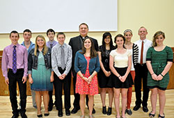 Archbishop Joseph W. Tobin and keynote speaker Liz Miskowiec pose with the A Promise to Keep high school mentors at St. Paul the Apostle Parish in Greencastle after the annual A Promise to Keep: God’s Gift of Human Sexuality peer mentor luncheon at the Archbishop Edward T. O’Meara Catholic Center in Indianapolis on April 11. (Photo by Natalie Hoefer)