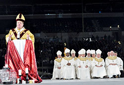 With 11 bishops from around the country listening, Archbishop Joseph W. Tobin delivers a homily to 23,000 teens at the closing Mass of the National Catholic Youth Conference on Nov. 23 at Lucas Oil Stadium in Indianapolis. (Photo by Natalie Hoefer) 