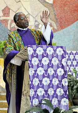 Father Kenneth Taylor, pastor of Holy Angels Parish in Indianapolis, gives a homily on Dec. 1 at St. Rita Church in Indianapolis during the Mass celebrating the 10th anniversary of the archdiocesan African Catholic Ministry. (Photo by Natalie Hoefer)