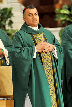 Chaldean Catholic Archbishop Bashar Warda of Irbil, Iraq, concelebrates an Aug. 23 Mass at SS. Peter and Paul Cathedral in Indianapolis. The archbishop visited several U.S. cities and discussed his experience with the flood of Christian refugees to Irbil following the Islamic State's capture of Mosul and the Ninevah Plain. (Photo by Sean Gallagher) 