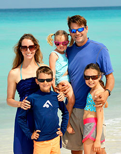 During their 17-month ocean journey, Jen and Marc Konesco pose for a photo with their children, Camden, left, Maria and Joellen. The Catholic family sold their Indianapolis-area home to live their dream. (Submitted photo)