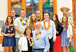 The 10 children of Jim and Ann Selby of St. Monica Parish in Indianapolis have been in Catholic schools across a span of 37 straight years—a span that will end on June 1 when their youngest child Jacob will graduate from Cardinal Ritter Jr./Sr. High School in Indianapolis. Nine of the 10 children are pictured here with their parents in a photo from 2014 when they threw a surprise party for their parents to celebrate their 60th birthdays. The children, from left to right, are Sarah, Patrick, Christopher, Maria, Andrew, Jacob, Anna, Caitlin and Matthew. The oldest child, Jon, was unable to attend. (Submitted photo)