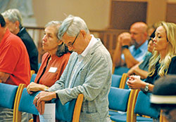 Katherine and Norbert Krapf kneel in silent prayer during the “Holy Hour of Prayer, Penance and Healing” in SS. Peter and Paul Cathedral in Indianapolis on Sept. 15. (Photo by Sean Gallagher)