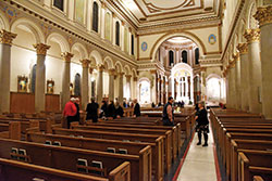 Visitors appreciate the restoration work done to St. Joan of Arc Church during an open house on Dec. 11, 2019. The $2.2 million phase of the project regarding the interior of the church sought to enhance its beauty. The parish’s current church was completed in 1929. (Photo by Sean Gallagher)