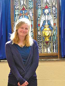 Katie Wesolowski, 28, who strives to live her life as a daughter of Christ, stands in the chapel of the Archbishop Edward T. O’Meara Catholic Center in Indianapolis. (Photo by Natalie Hoefer)