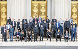 Archbishop Charles C. Thompson and archdiocesan director of seminarians Father Eric Augenstein pose on Aug. 15 on the front steps of SS. Peter and Paul Cathedral in Indianapolis with 31 of the archdiocese’s 32 seminarians. (Submitted photo by Holly Dexter)