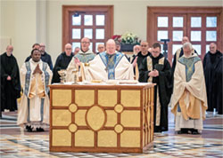 Benedictine Archabbot Kurt Stasiak prays the eucharistic prayer during a Jan. 25 Mass at the Archabbey Church of Our Lady of Einsiedeln in St. Meinrad. The monks of Saint Meinrad Archabbey in St. Meinrad live a life of giving thanks to God, especially in the Eucharist. (Photo courtesy of Saint Meinrad Archabbey)