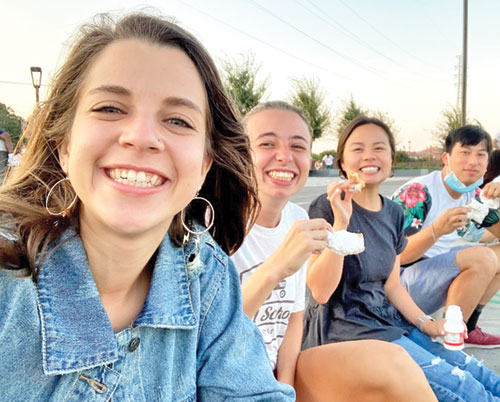 Meagan Morrisey, left, the current director of the archdiocese’s young adult and college campus ministry, shares a moment of joy with students at Tulane University in New Orleans while she served there as a FOCUS (Fellowship of Catholic University Students) missionary from 2018-21. (Submitted photo)