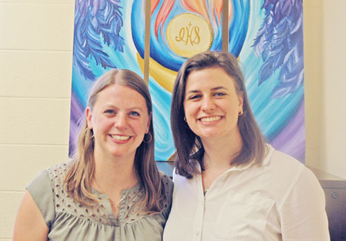 Rachel Gilman, left, and Megan Lauritsen work together as the leaders of youth ministry in the archdiocese. (Photo by John Shaughnessy)