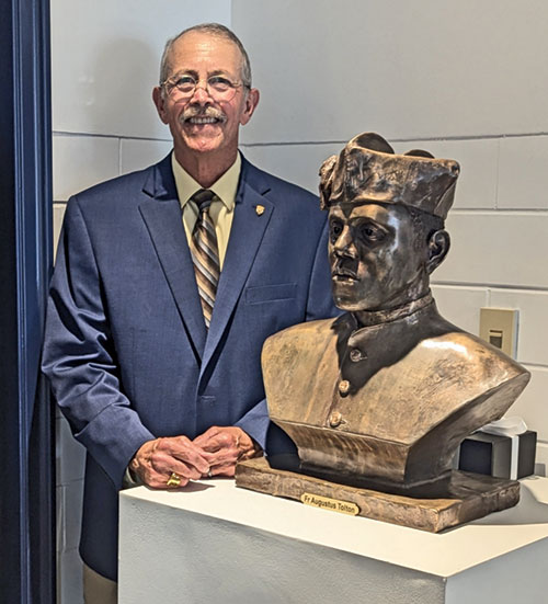 Forrest Tucker, a member of Mary, Queen of Peace Parish in Danville, unveiled his sculptures of Father Augustus Tolton, the first recognized priest of African descent in the United States, during an event at Marian University in Indianapolis on July 16. (Photo by Ann Margaret Lewis) 