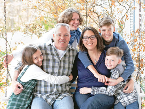 Ute and Joe Eble are joined with their children in this family photo, with Annika, and Michael behind their parents and Katja and Joshua next to them. (Submitted photo)