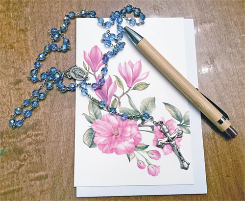 Thanks to seeds planted by Father John Hollowell and Father Jonathan Meyer, Janine Schorsch prays the rosary for people and writes notes of encouragement to them. (Submitted photo)